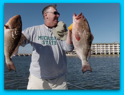 Grig with two of his keeper Red Grouper. 11/15/2009 
